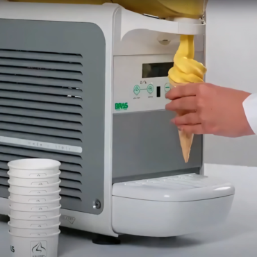 BRAS B-Cream HD 2 twin bowl frozen dessert machine dispensing soft serve into an ice cream cone on the counter at Slush WA